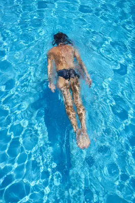 Relaxed Lap Swimming in Bright Blue Pool