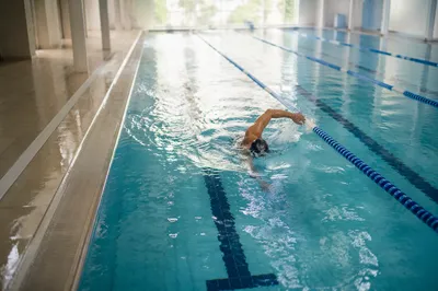 Calm Indoor Swimming Laps at Dawn