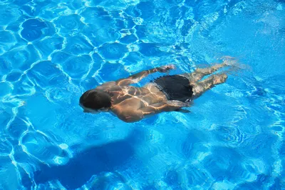 Relaxed Lap Swimming in Bright Pool