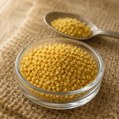 Golden Vitamin Granules in Glass Dish