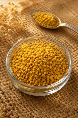 Golden Vitamin Granules in Glass Dish