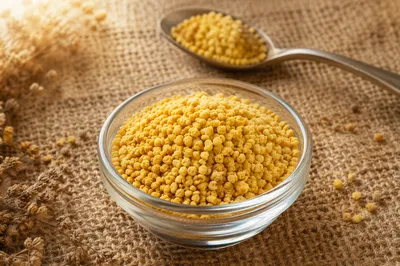 Golden Vitamin Granules in Glass Dish