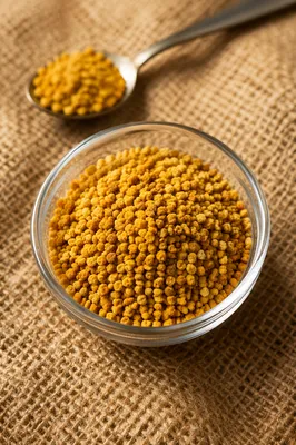 Golden Vitamin Granules in Glass Dish